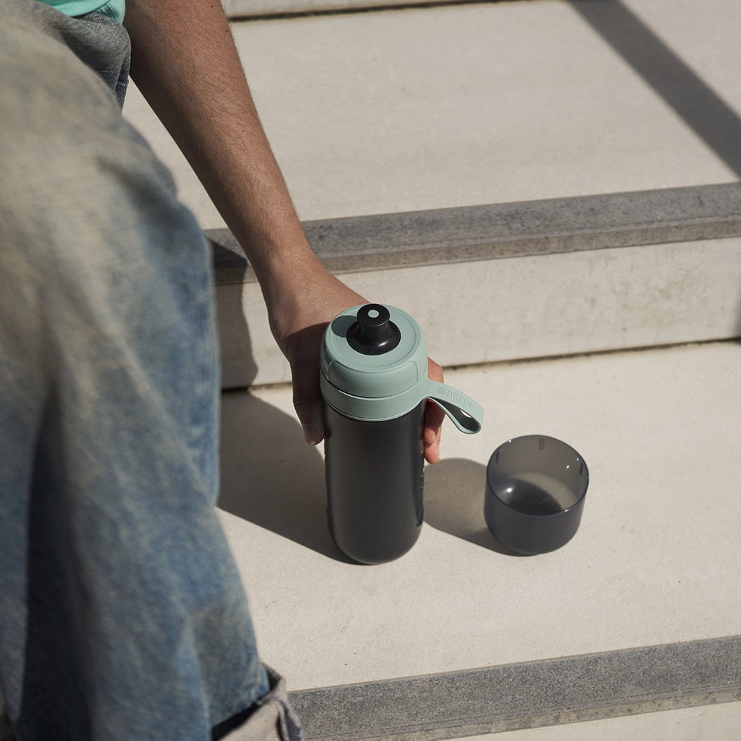 BRITA water filter bottle Model Active in green standing outside